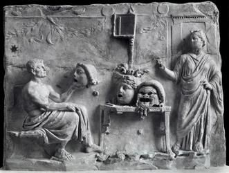 Relief depicting Menander with theatrical masks, copy of a Greek original